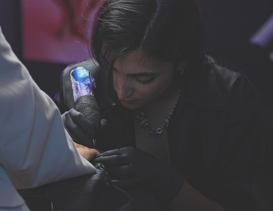 Tattoo artist at work in the studio